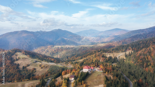 Autumn forest road landscape. Mountain forest road in autumn. Road in autumn mountain forest scene. Mountain Divcibare in western Serbia.
