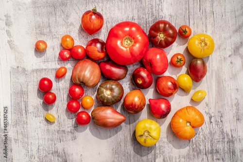 fresh tomatoes on the wooden background
