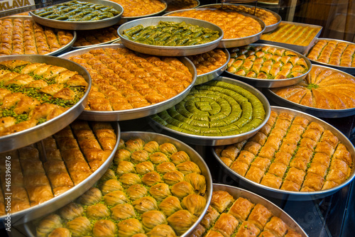 Baklava varieties on dessert store. Turkish baklava on tray. Traditional Baklava from Gaziantep, Turkey. Baklava with pistachio. photo