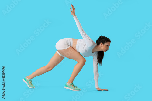 Sporty female runner on col...