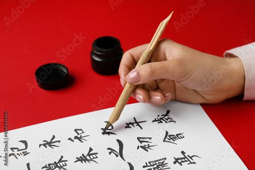 Asian calligraphist writing...
