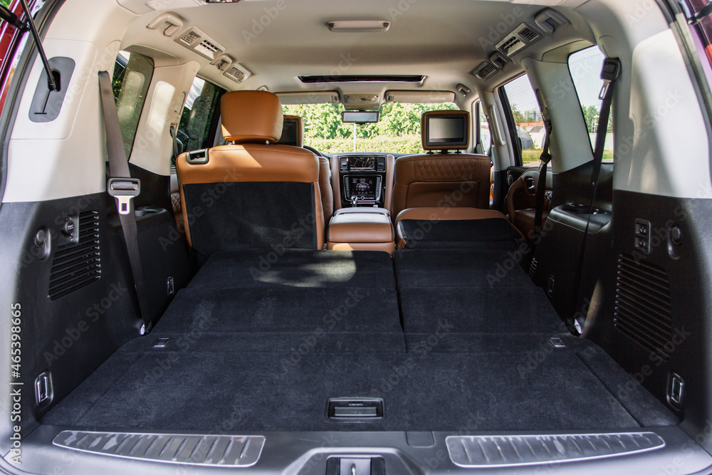 Huge, clean and empty car trunk in interior of compact suv. Rear view of a SUV car with open trunk Huge, clean and empty car trunk in interior of compact suv. Rear view of a SUV car with open trunk