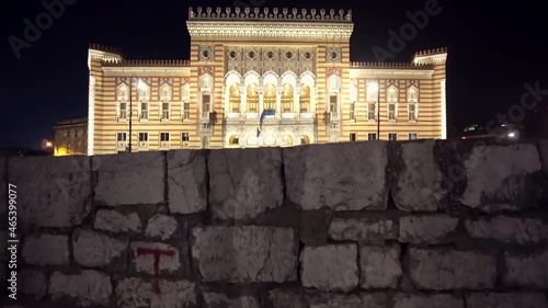 National and University Library of Bosnia and Herzegovina (former City Hall) at nigth with city traffic photo