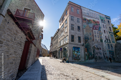 Quebec, Canada - October 20 2021 : Fresco Wall Art in the Quebec City Old Town in autumn sunny day. Mural of Quebecers.