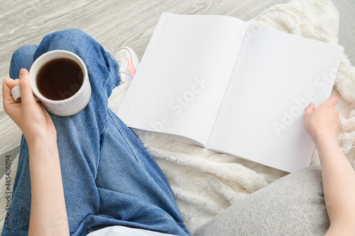 Woman with blank magazine a...