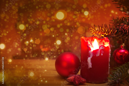 Christmas background with burning candle and fir tree branch