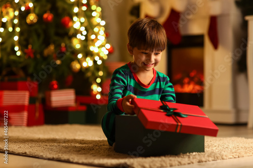 Cute little boy opening Chr...