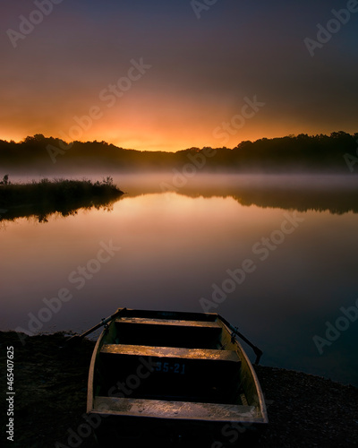 row boat on the lake at sunrise 