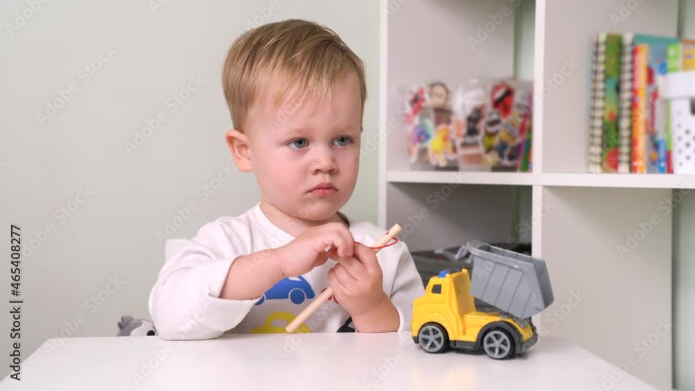 Sad Little Child Sitting Table Holds Stick Rope Sad Little Child Sitting Table Holds Stick Rope