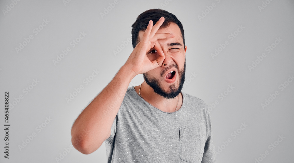 Young man in the studio on a gray background Young man in the studio on a gray background