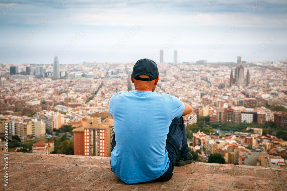 person in front of the city of Barcelona