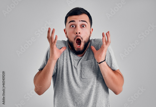 Young man in the studio on a gray background