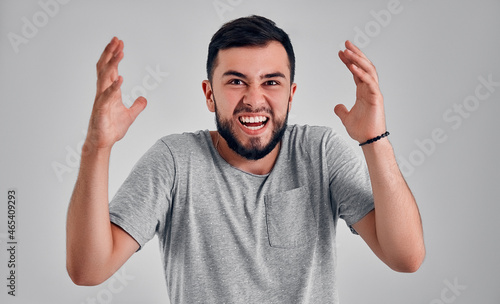 Young man in the studio on a gray background