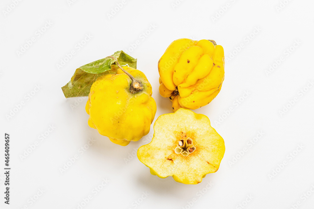 Ripe whole and cut quince isolated on white background Ripe whole and cut quince isolated on white background
