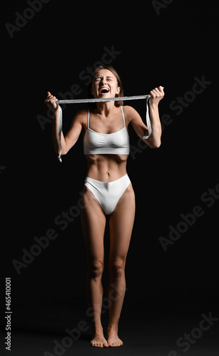 Stressed woman with measuri...