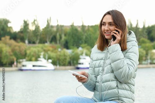 Young woman with phone and ...