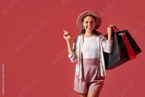 Happy young woman in hat an...