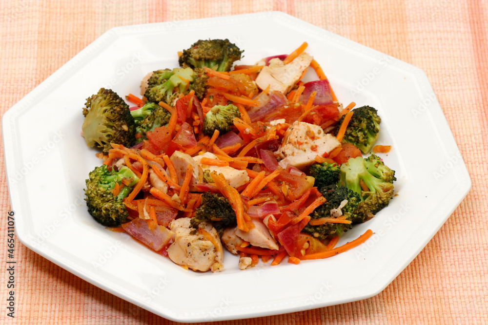 Plated Cooked Dinner of Broccoli, Chicken Meat and Vegetables Plated Cooked Dinner of Broccoli, Chicken Meat and Vegetables