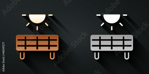 Gold and silver Solar energy panel icon isolated on black background. Long shadow style. Vector