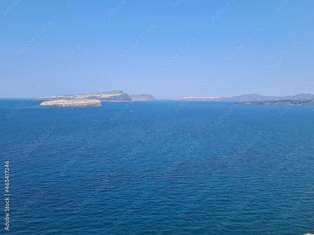 Beautiful Santorini island landscape with sea, sky and clouds. Oia town, Greece landmark in summer Beautiful Santorini island landscape with sea, sky and clouds. Oia town, Greece landmark in summer
