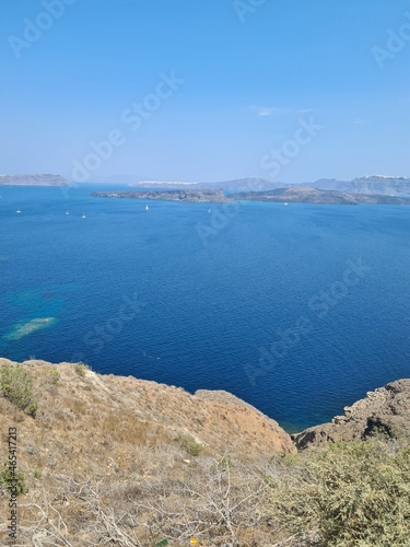 Beautiful Santorini island landscape with sea, sky and clouds. Oia town, Greece landmark in summer