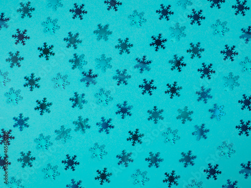 Background from blue snowflakes. Blue background.