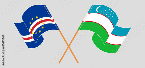 Crossed and waving flags of Cape Verde and Uzbekistan