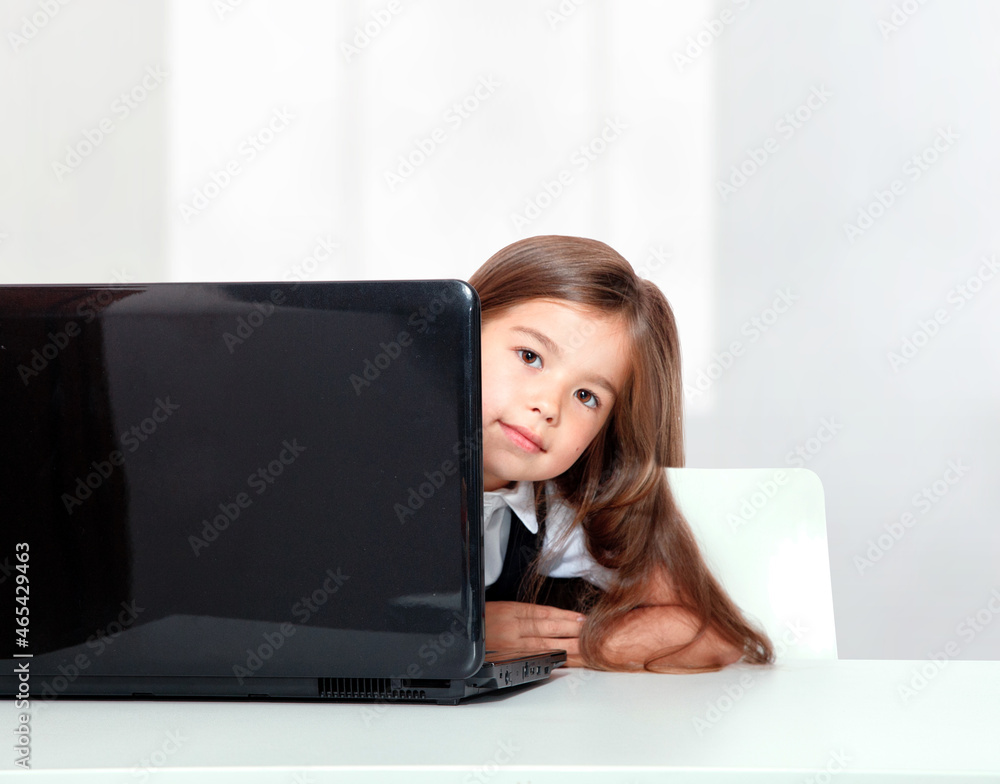 Happy and cute teen school girl sitting on laptop Happy and cute teen school girl sitting on laptop