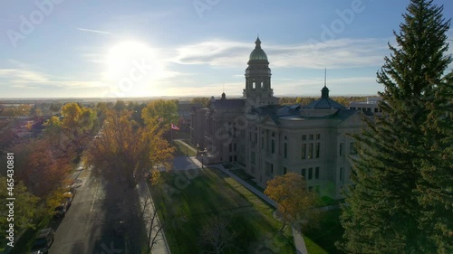 Wyoming Capitol Building in Cheyenne at sunset. Aerial drone footage flying slowly towards the building exterior. photo