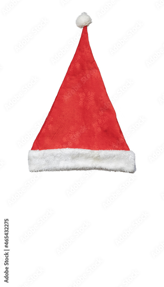 Red santa hat with white bubo and edging and a pattern in the form of snowflakes on an isolated background Top view Red santa hat with white bubo and edging and a pattern in the form of snowflakes on an isolated background Top view