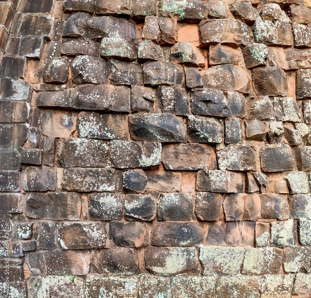 Naklejka premium Ancient stone wall texture background