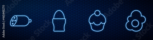 Set line Muffin, Salami sausage, Chicken egg on stand and Scrambled. Glowing neon icon on brick wall. Vector