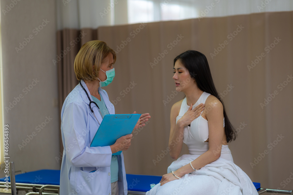 Senior female doctor exam the female patient in the hospital. Senior female doctor exam the female patient in the hospital.