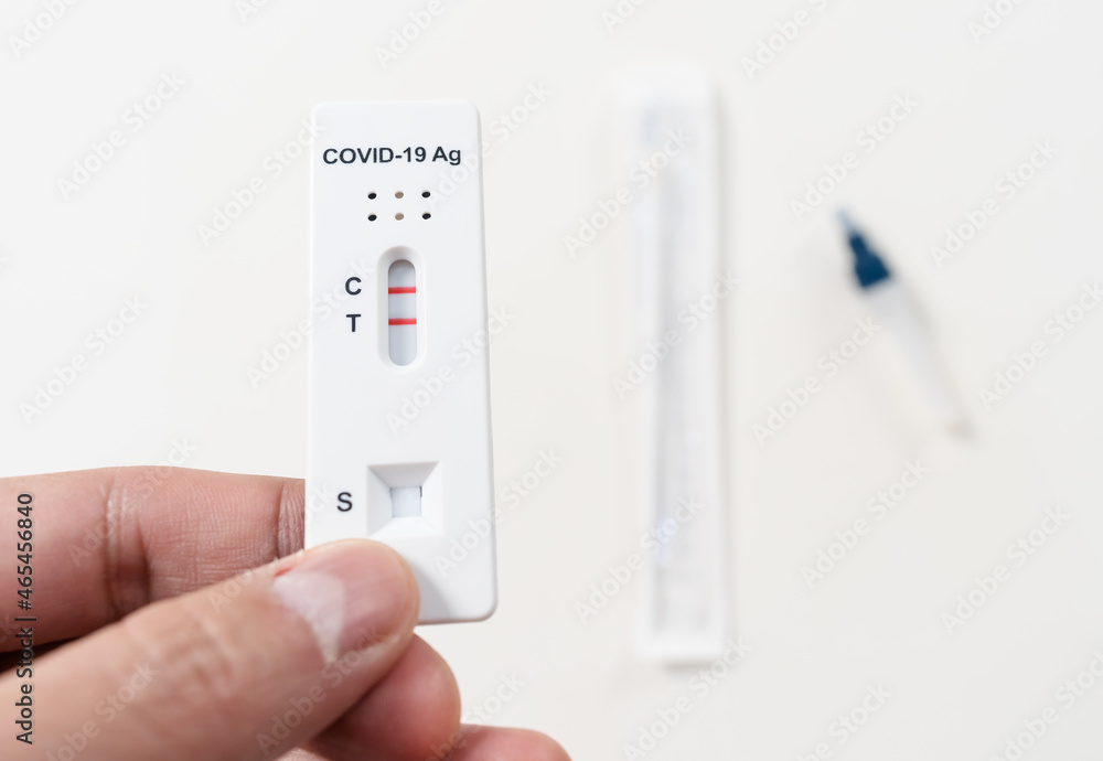 hand with Coronavirus(Covid-19) positive test result with SARS-CoV-2 Antigen Rapid Test kits for Self testing hand with Coronavirus(Covid-19) positive test result with SARS-CoV-2 Antigen Rapid Test kits for Self testing