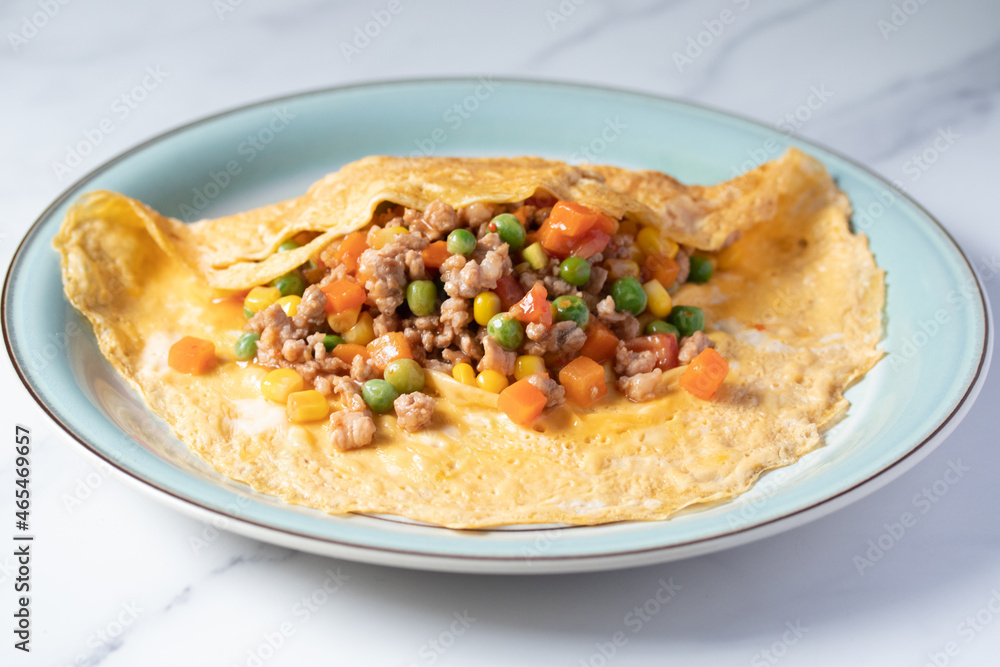 Stuffed Omelette, pork and carrots, corn, green peas, Thai food Stuffed Omelette, pork and carrots, corn, green peas, Thai food