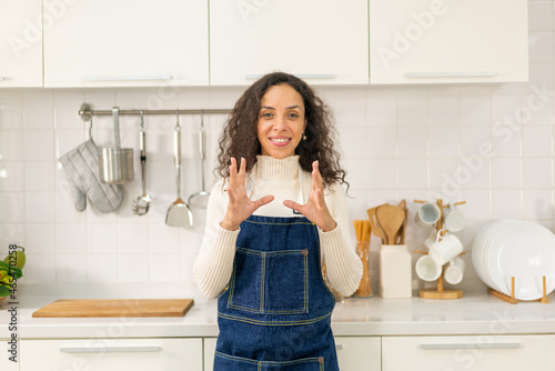 portrait Latin woman in kitchen