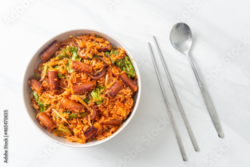 Stir-fried squid or octopus with Korean spicy sauce rice bowl photo