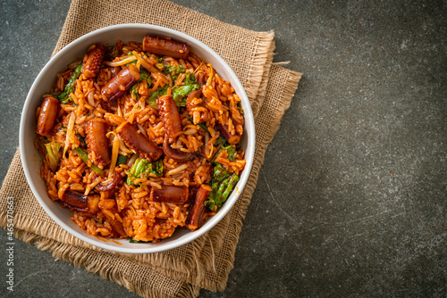 Stir-fried squid or octopus with Korean spicy sauce rice bowl photo