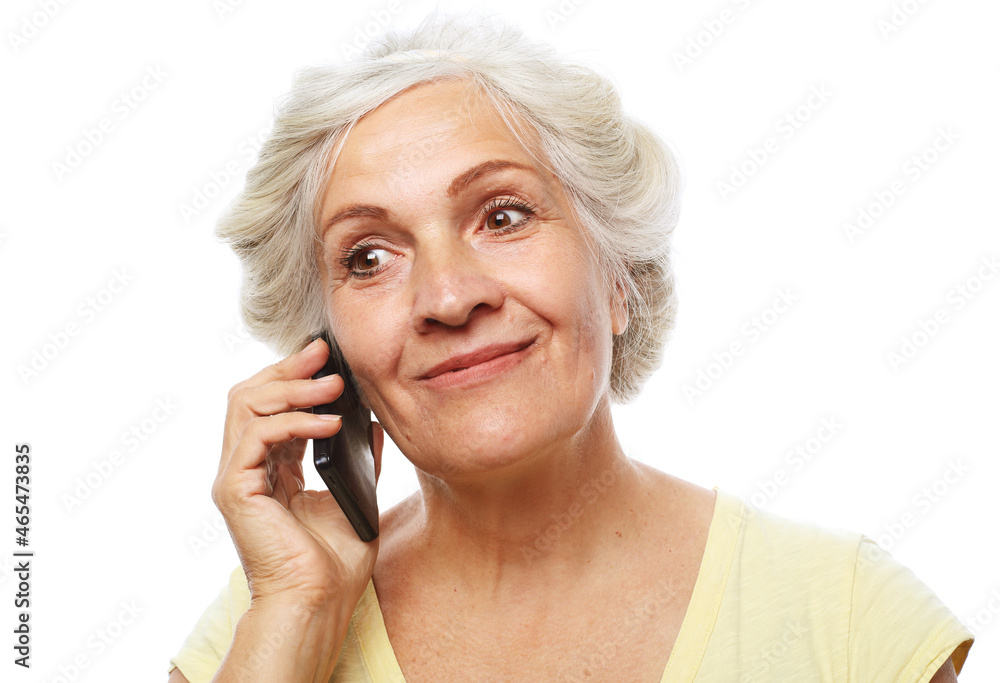 Smiling senior woman talking with mobile phone. Smiling senior woman talking with mobile phone.