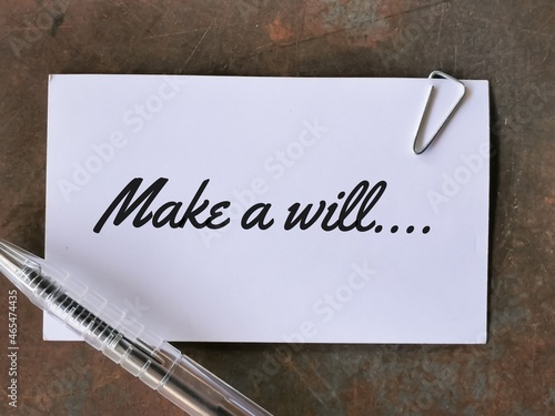 Phrase make a will written on white card with a pen. photo