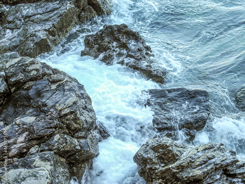waves hitting rocks in the summer sun in Budva, Montenegro