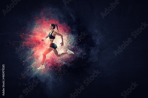 Athletic woman runner on colourful background