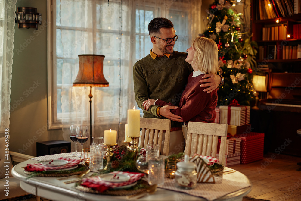 Couple in love celebrating Christmas at home Couple in love celebrating Christmas at home