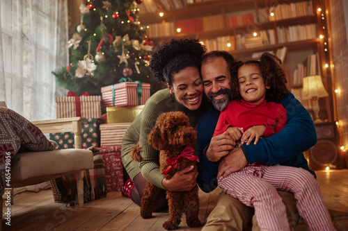 Mixed race family celebrating Christmas at home photo