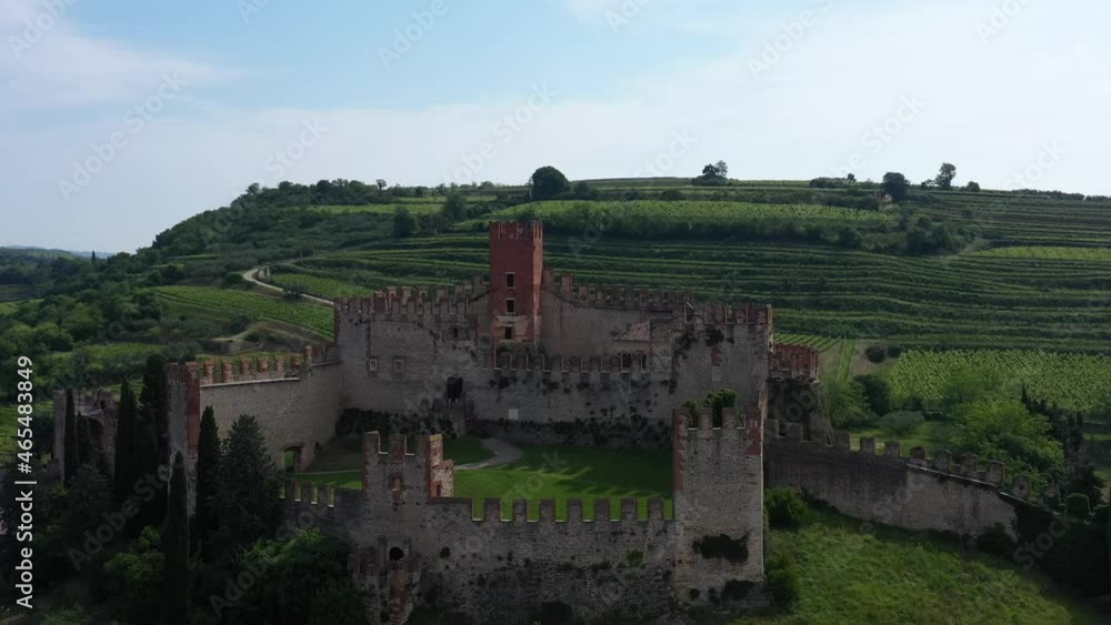 The famous medieval castle on the hill. Aerial view, point of interest on Soave castle, province of Verona, Italy. Italian historic castles. Aerial panorama of the castles of Italy. The famous medieval castle on the hill. Aerial view, point of interest on Soave castle, province of Verona, Italy. Italian historic castles. Aerial panorama of the castles of Italy.