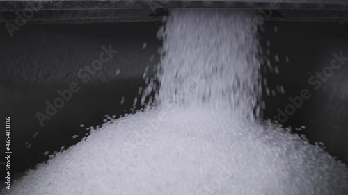 The plastic granules are poured into a large tank. Production of polymer compounds. photo