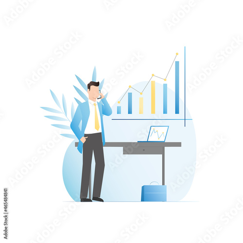 Man in official suit is standing, talking on smartphone in office. Guy works in laptop in office, at workplace. Businessman solves issues of company, analyzes charts, investment diagrams, financing.