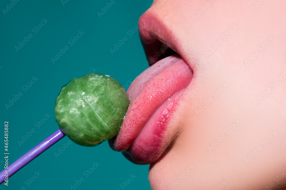 Licking lips. Woman licking lollipop, art banner, red lips with lollipop. Sexy red female mouth and tongue with lolli pop. Art print for design. - obrazy, fototapety, plakaty 