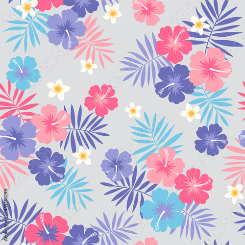 Hibiscus, frangipani and palm leaf seamless pattern background.