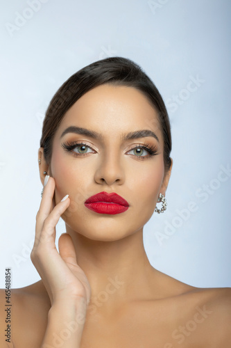 Fashion portrait of a beautiful young woman with make up